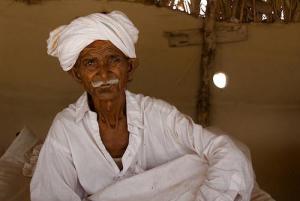 An elderly man in Pakistan, in his home, photo by Annie Griffiths